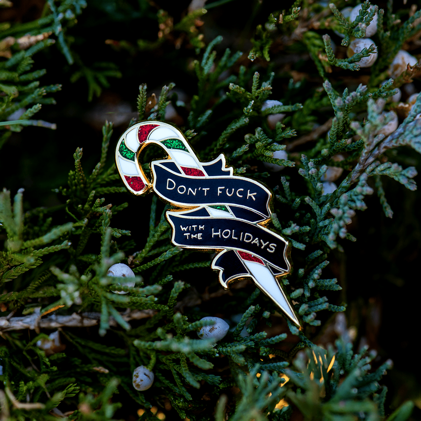 "Don't Fuck With the Holidays" Candy Cane Enamel Pin by The Roving House