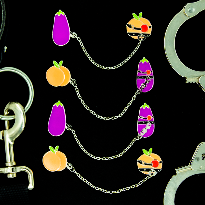 A display of all four variants of the kinky fruit pin sets.
