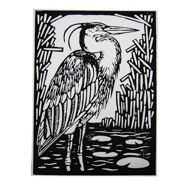 A large block printing of a great blue heron standing in a shallow pond.