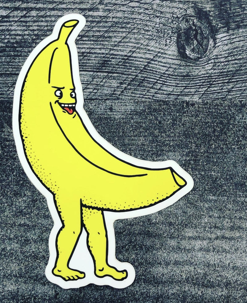 A sticker of a yellow banana with stubby human legs and a cross-eyed face with his tongue sticking out.
