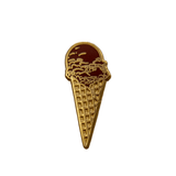 A gold metal and brown enamel pin of a chocolate ice cream waffle cone.
