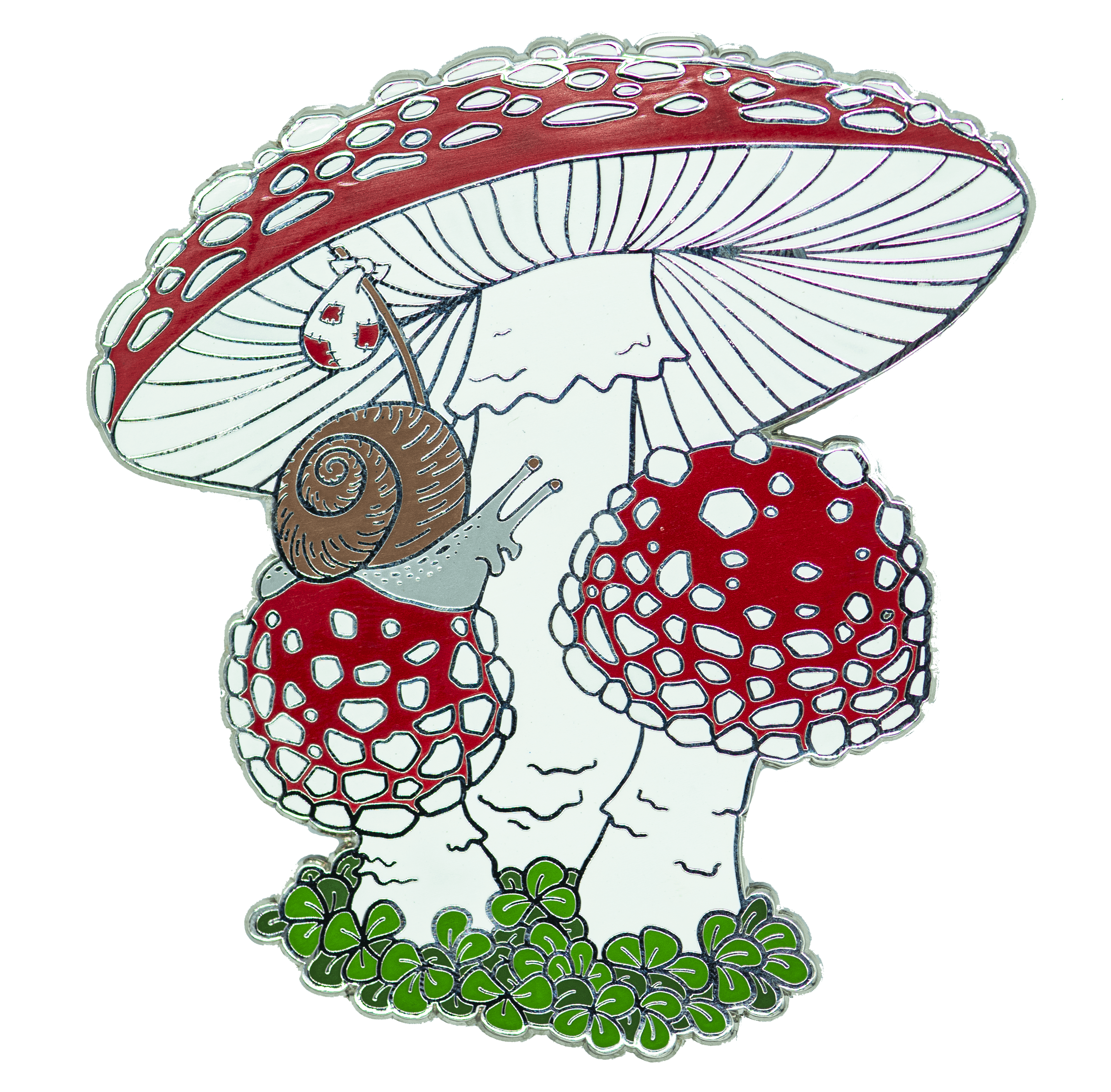 A large enamel pin featuring a snail carrying a bindle as he crawls over a trio of fly agaric mushrooms.