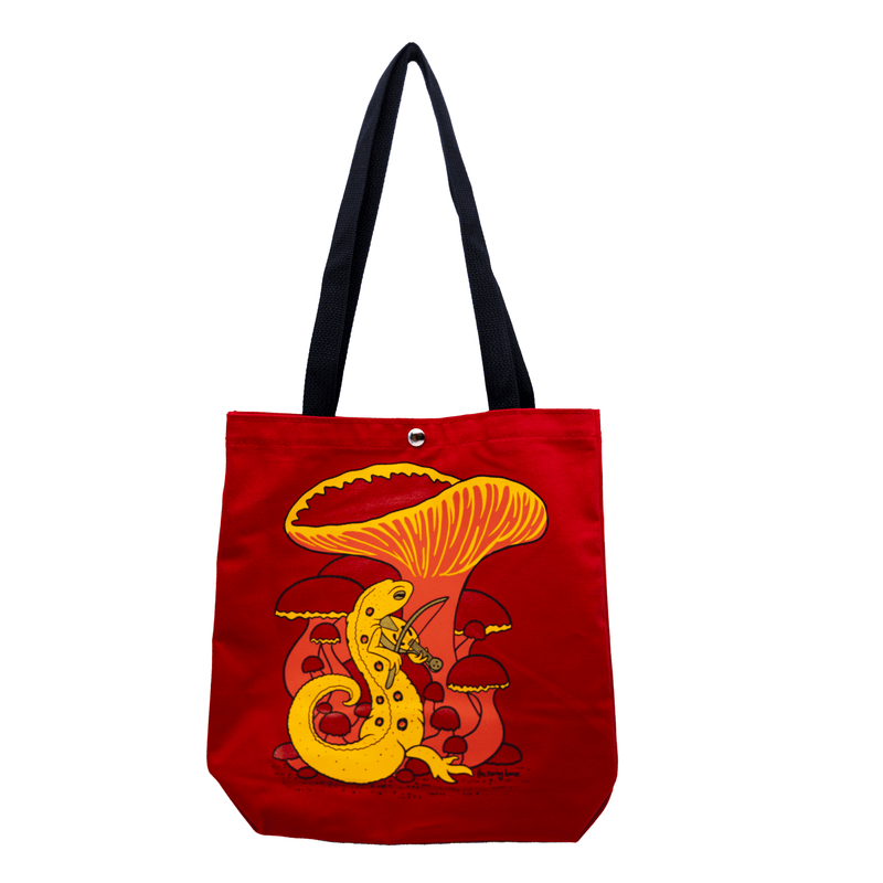 A bright red tote bag with a black handle and button closure. The artwork features a red eft newt merrily playing a medieval viellest under a cluster of red and orange mushrooms.